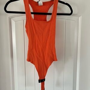 Orange bodysuit